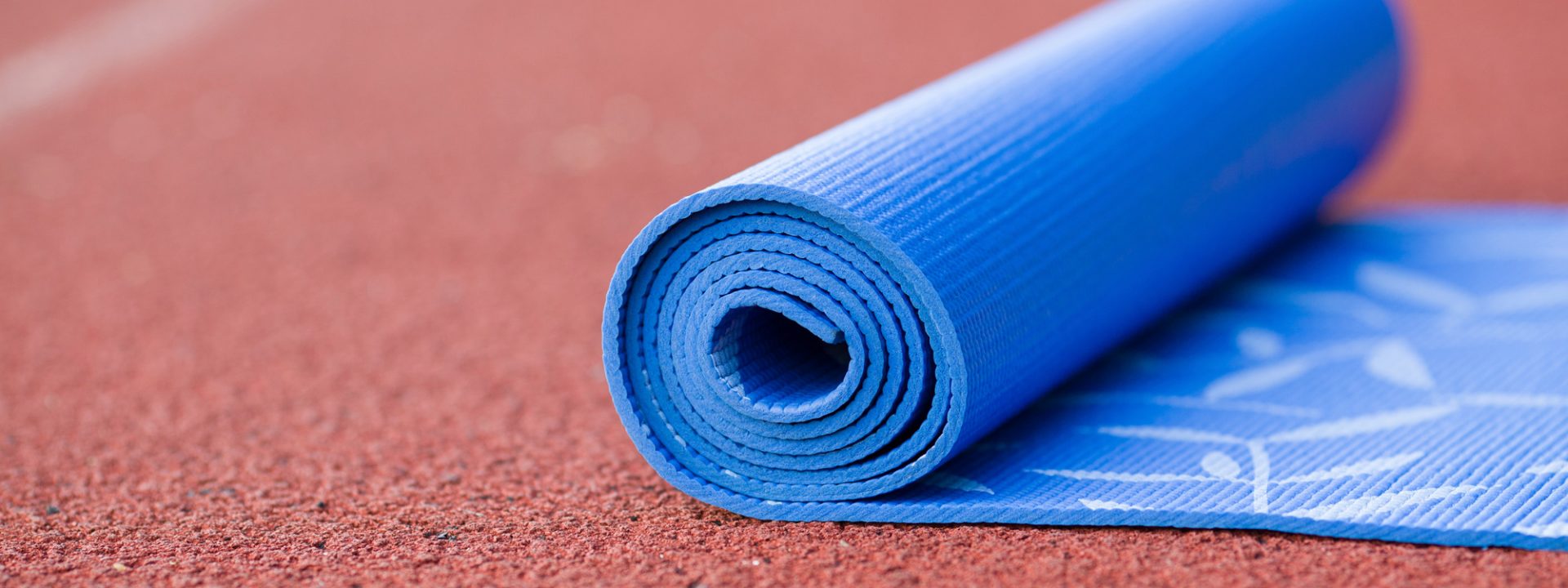 yoga mat on running track